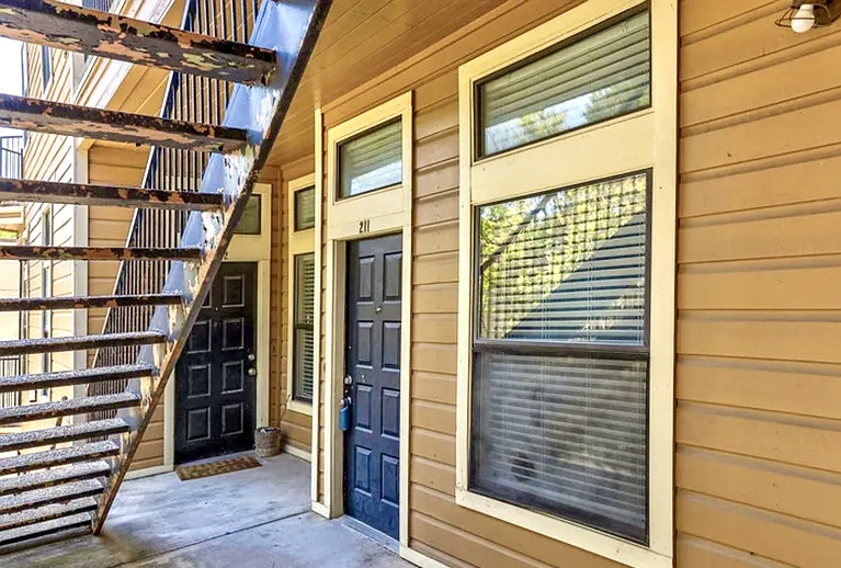 2802 Nueces Street, Unit 211 Austin, TX 78705 - Photo 3 of 14 a view of front door with stairs