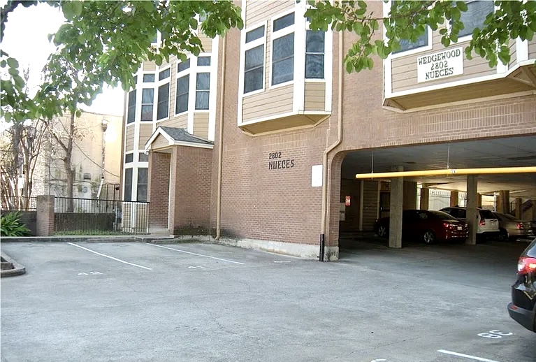 2802 Nueces Street, Unit 211 Austin, TX 78705 - Photo 5 of 14 a view of a car garage