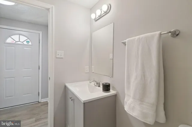a bathroom with a sink and mirror