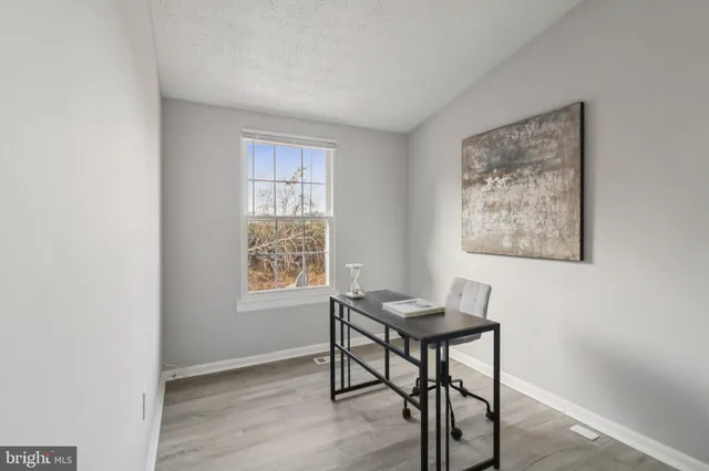 a workspace with furniture and a window