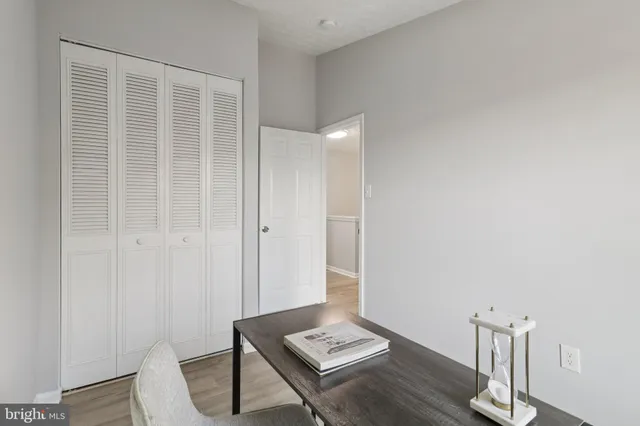 a view of room with furniture and wooden floor