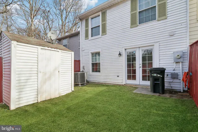 a view of a backyard with a large tree