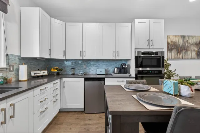 a living room with furniture and a rug