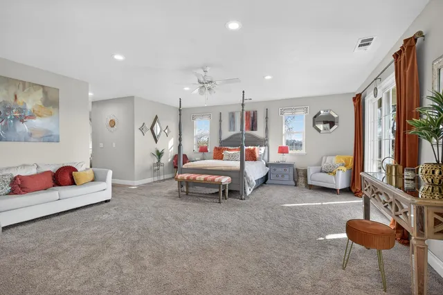 a bedroom with two beds and a window