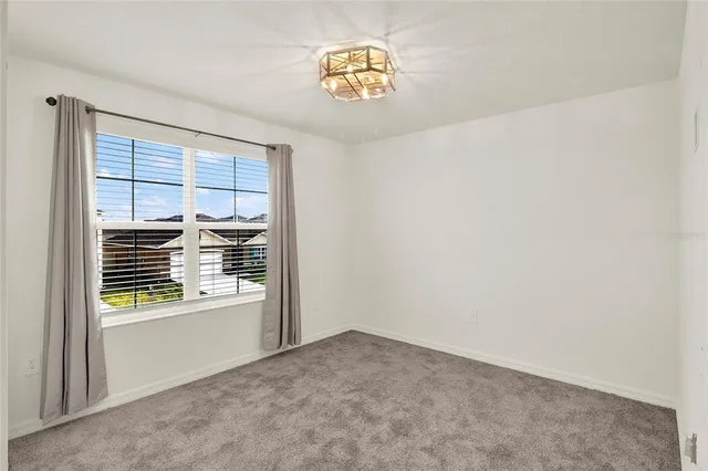 a view of empty room with a window