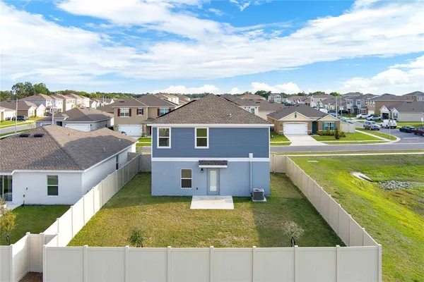 a aerial view of a house with a swimming pool