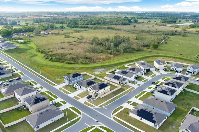 an aerial view of a city with lawn chairs