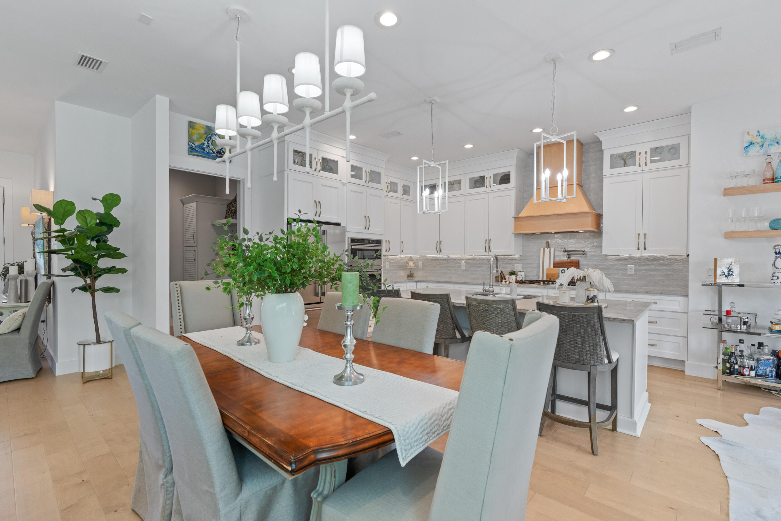1478 Driftwood Point Road Santa Rosa Beach, FL 32459 - Photo 15 of 95 a view of a dining room with furniture and a chandelier