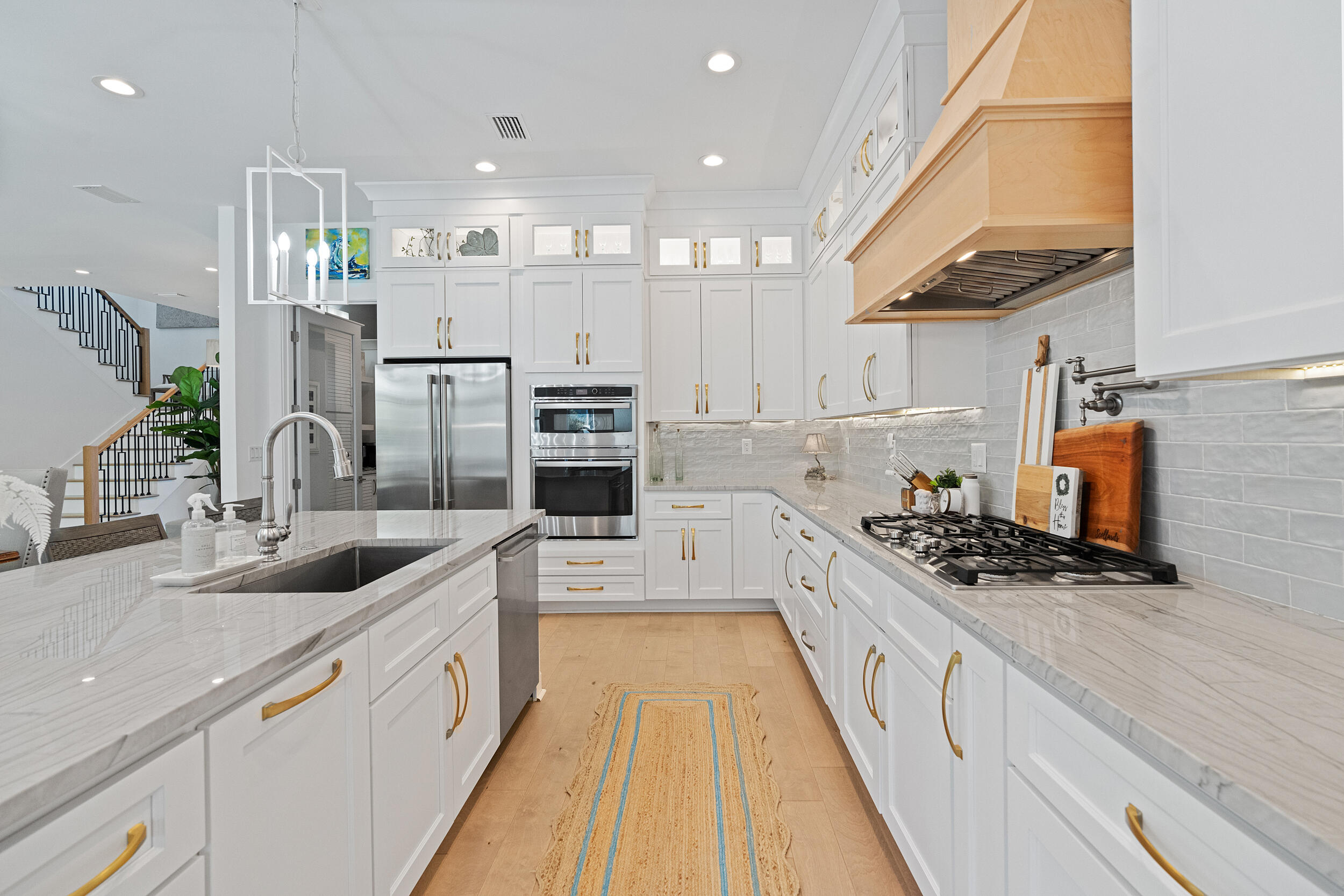 1478 Driftwood Point Road Santa Rosa Beach, FL 32459 - Photo 21 of 95 a large kitchen with stainless steel appliances a sink a stove and cabinets