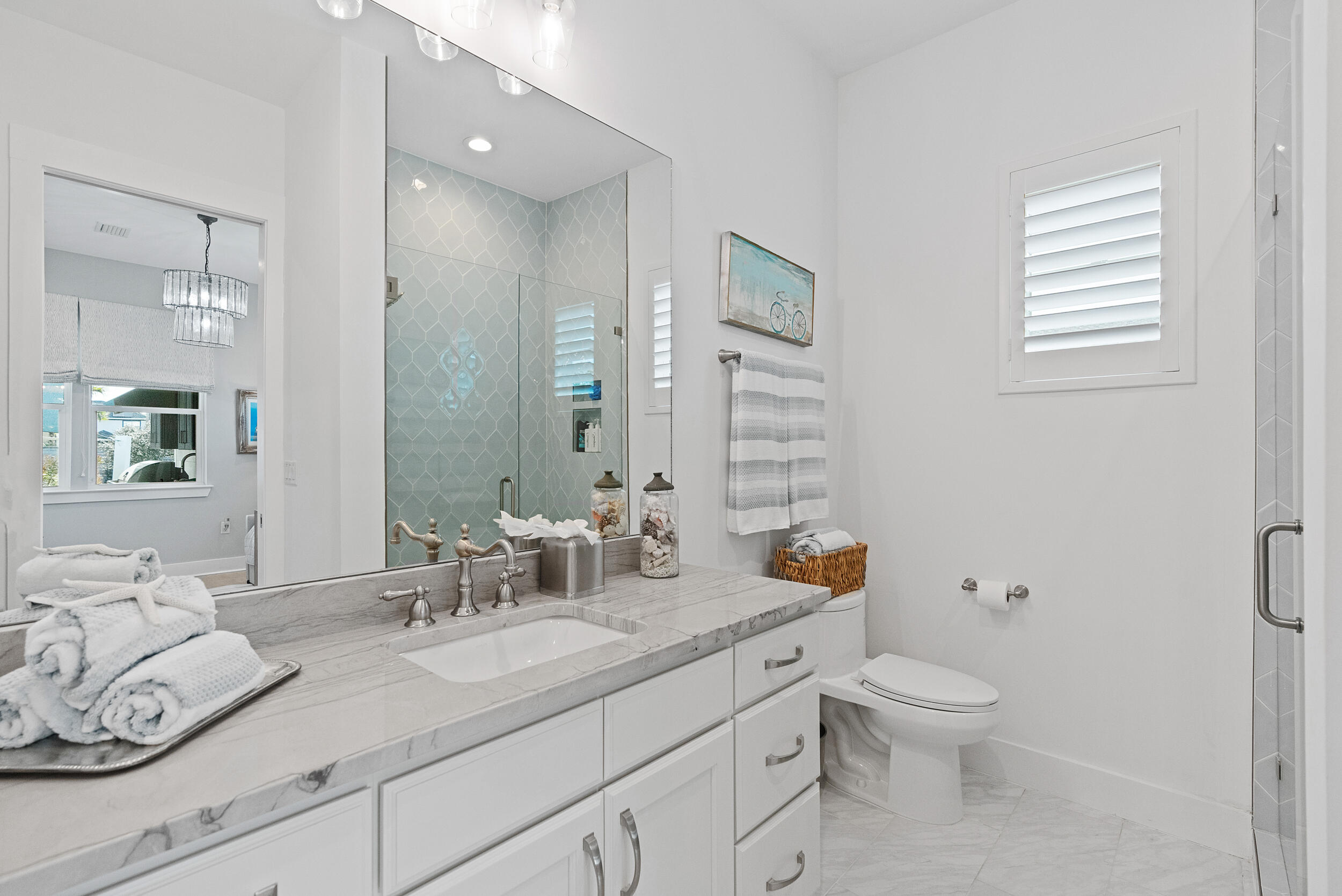 1478 Driftwood Point Road Santa Rosa Beach, FL 32459 - Photo 27 of 95 a bathroom with a granite countertop sink mirror vanity and toilet