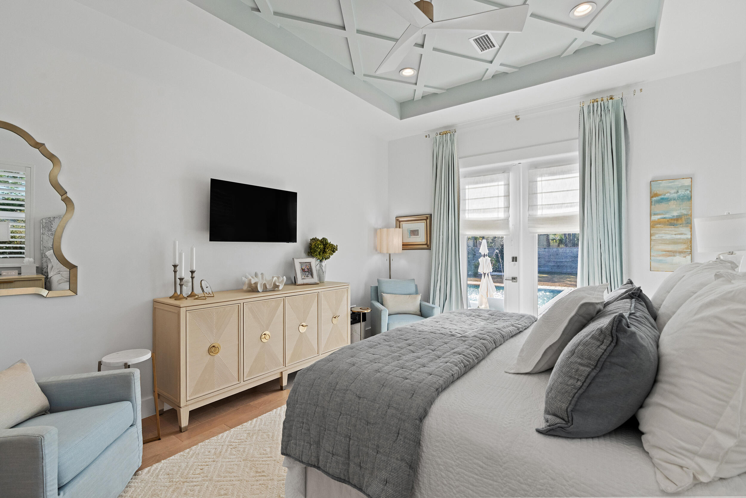 1478 Driftwood Point Road Santa Rosa Beach, FL 32459 - Photo 34 of 95 a spacious bedroom with a bed and a flat screen tv