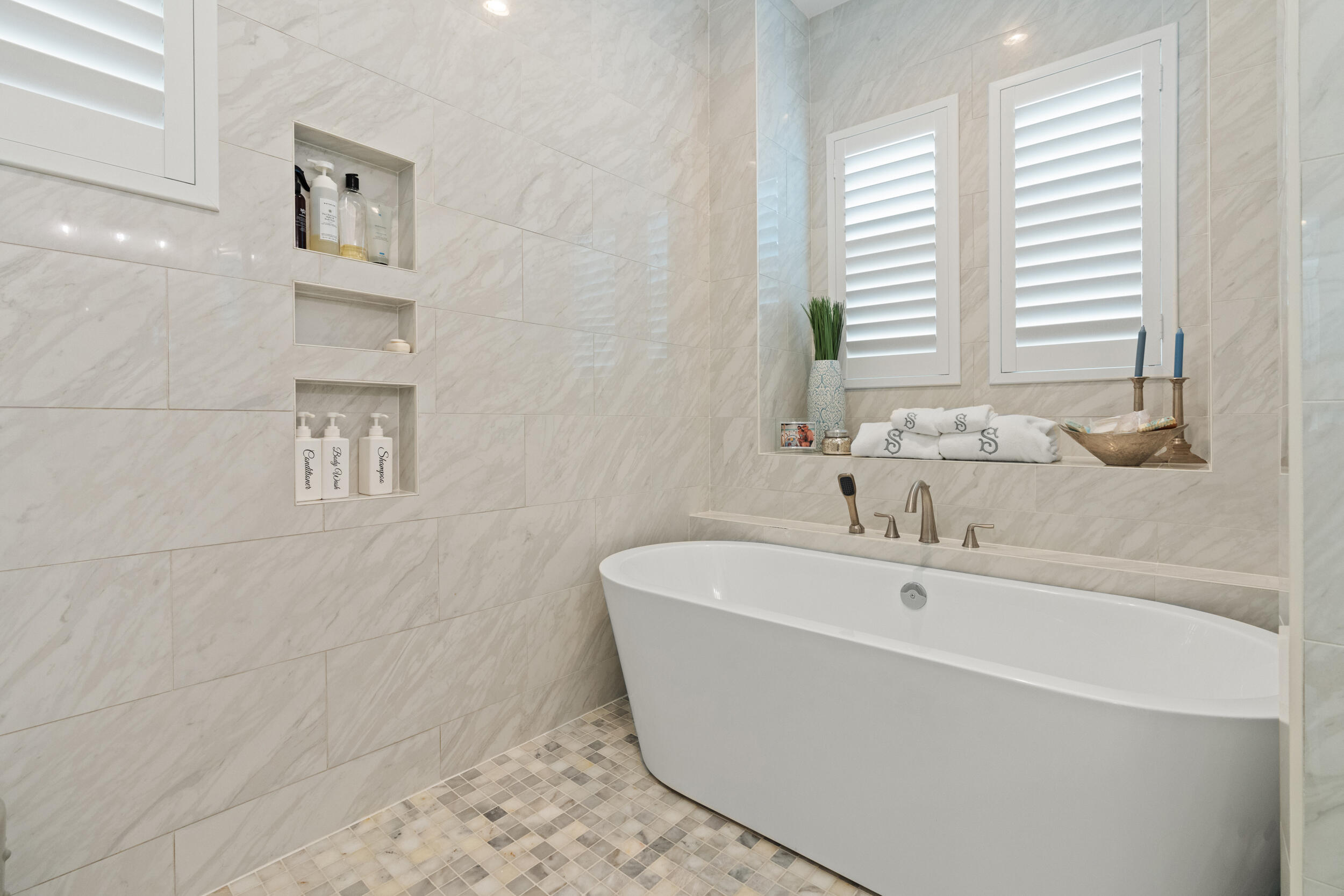 1478 Driftwood Point Road Santa Rosa Beach, FL 32459 - Photo 39 of 95 a white bath tub sitting in a bathroom