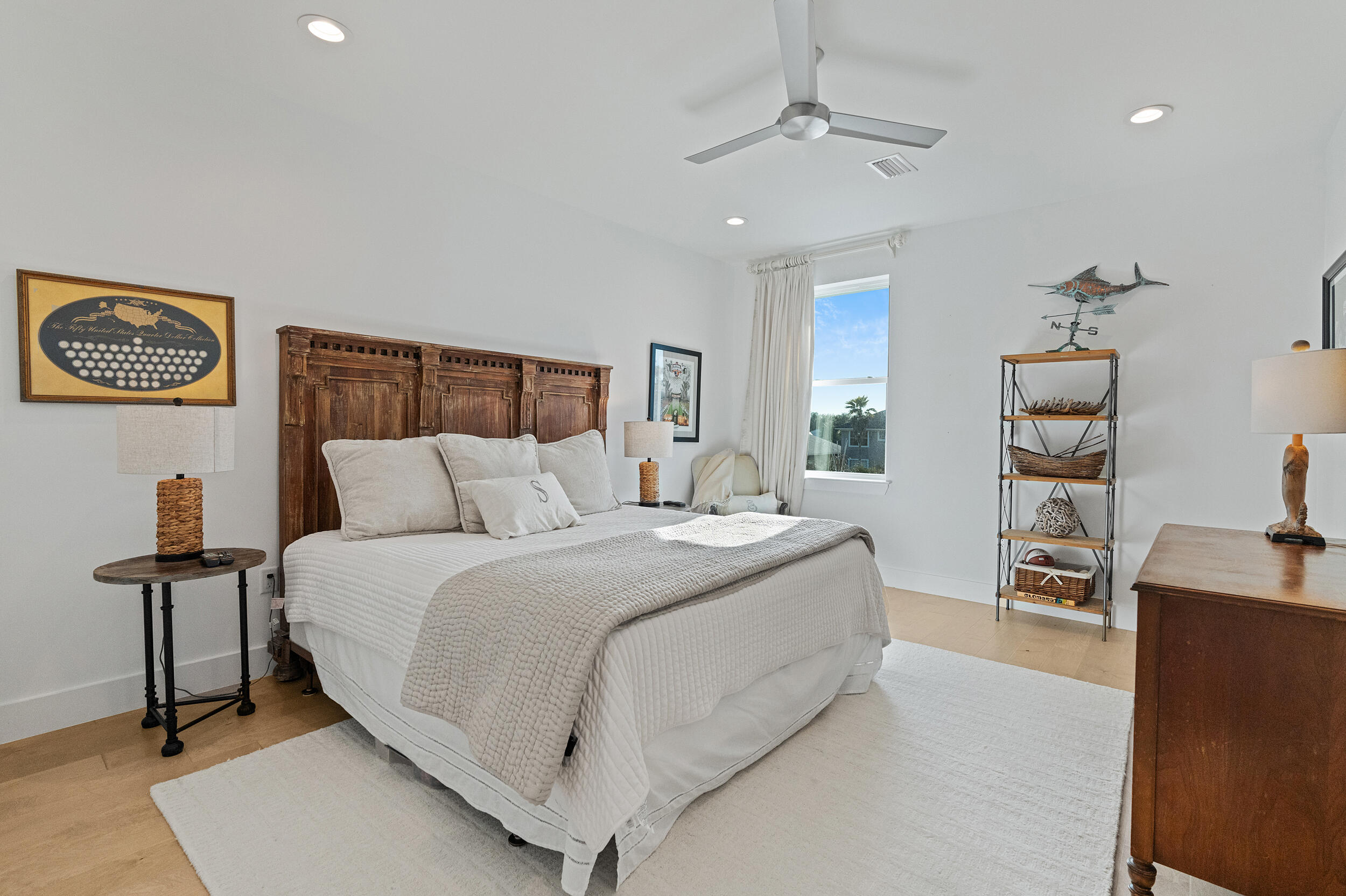 1478 Driftwood Point Road Santa Rosa Beach, FL 32459 - Photo 46 of 95 a spacious bedroom with a bed and a lamp on table