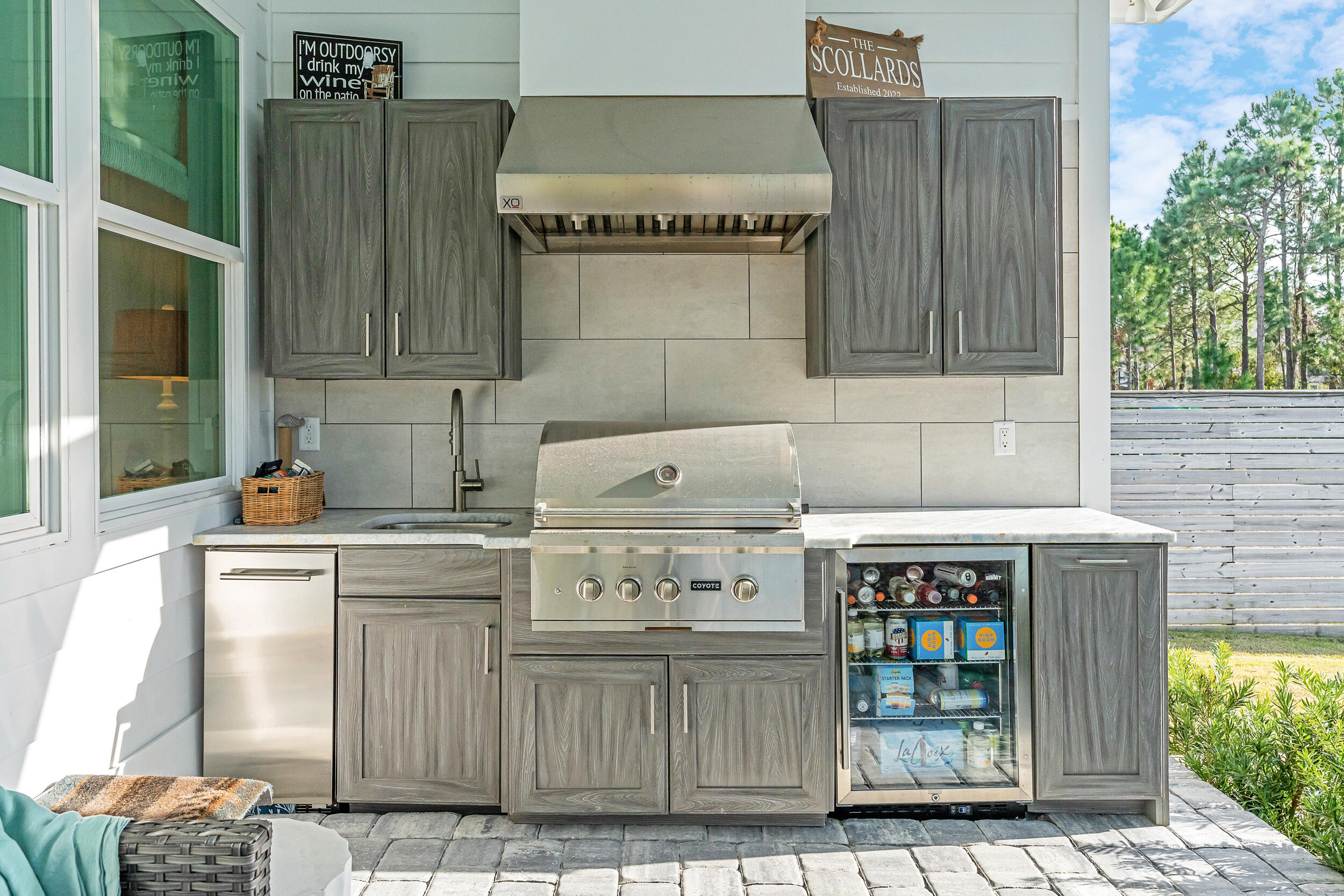 1478 Driftwood Point Road Santa Rosa Beach, FL 32459 - Photo 53 of 95 a kitchen with stainless steel appliances granite countertop a stove a cabinets and a refrigerator