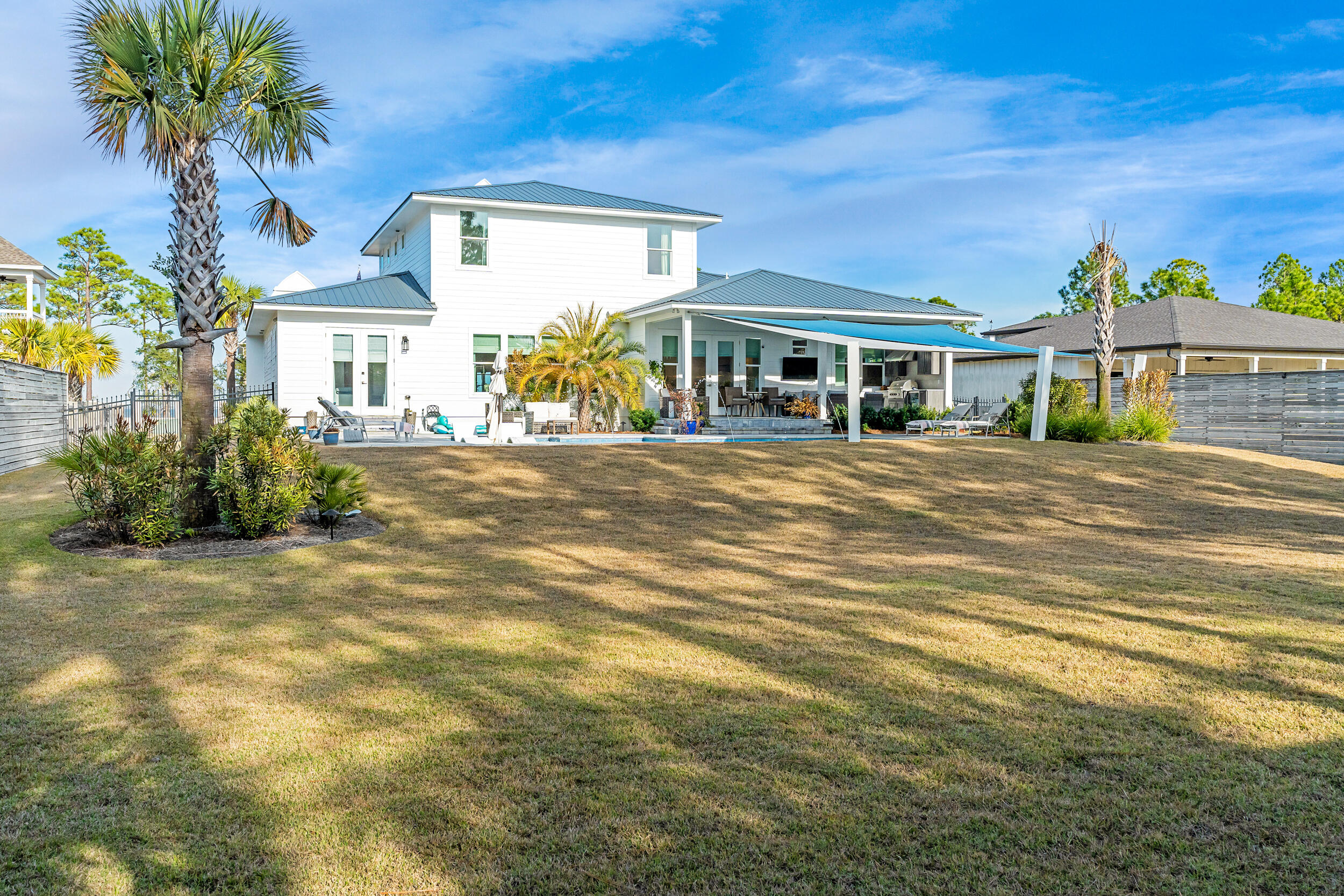 1478 Driftwood Point Road Santa Rosa Beach, FL 32459 - Photo 64 of 95 a front view of a house with a yard and garage