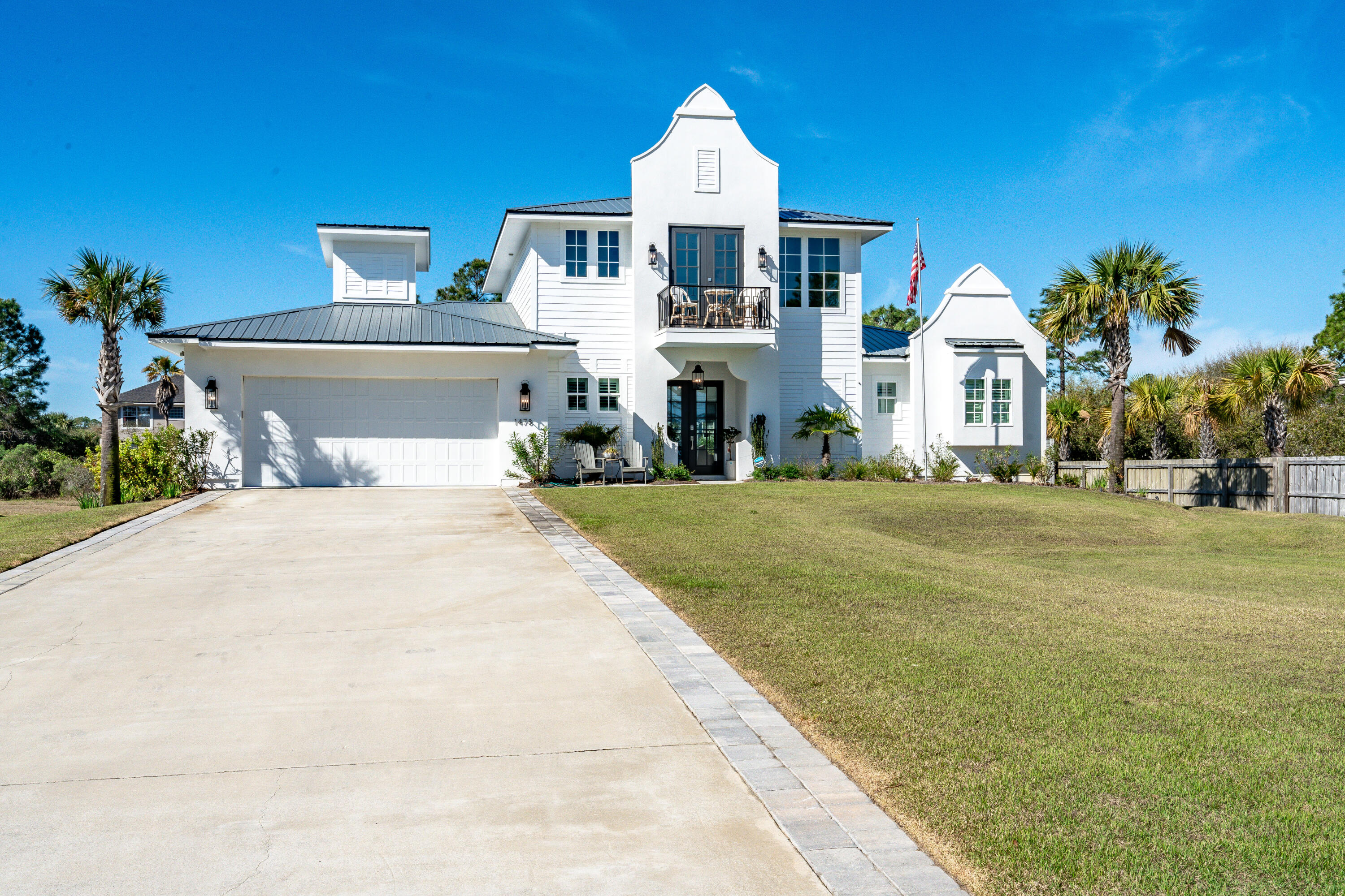 1478 Driftwood Point Road Santa Rosa Beach, FL 32459 - Photo 7 of 95 a front view of a house with a yard