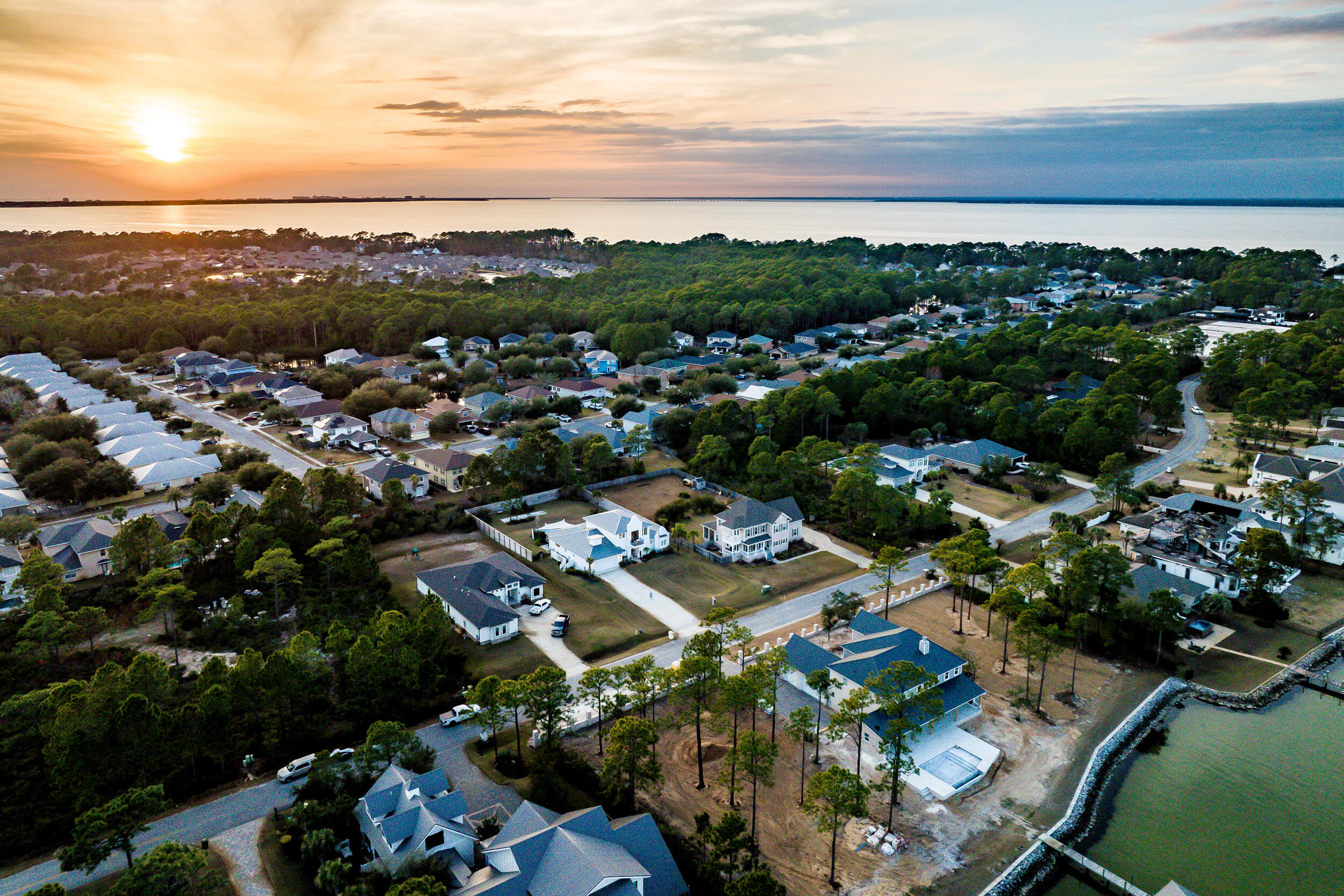 1478 Driftwood Point Road Santa Rosa Beach, FL 32459 - Photo 78 of 95 an aerial view of a city with lots of residential buildings and mountain view in back