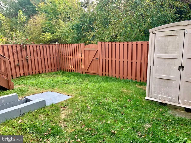 a view of backyard with green space