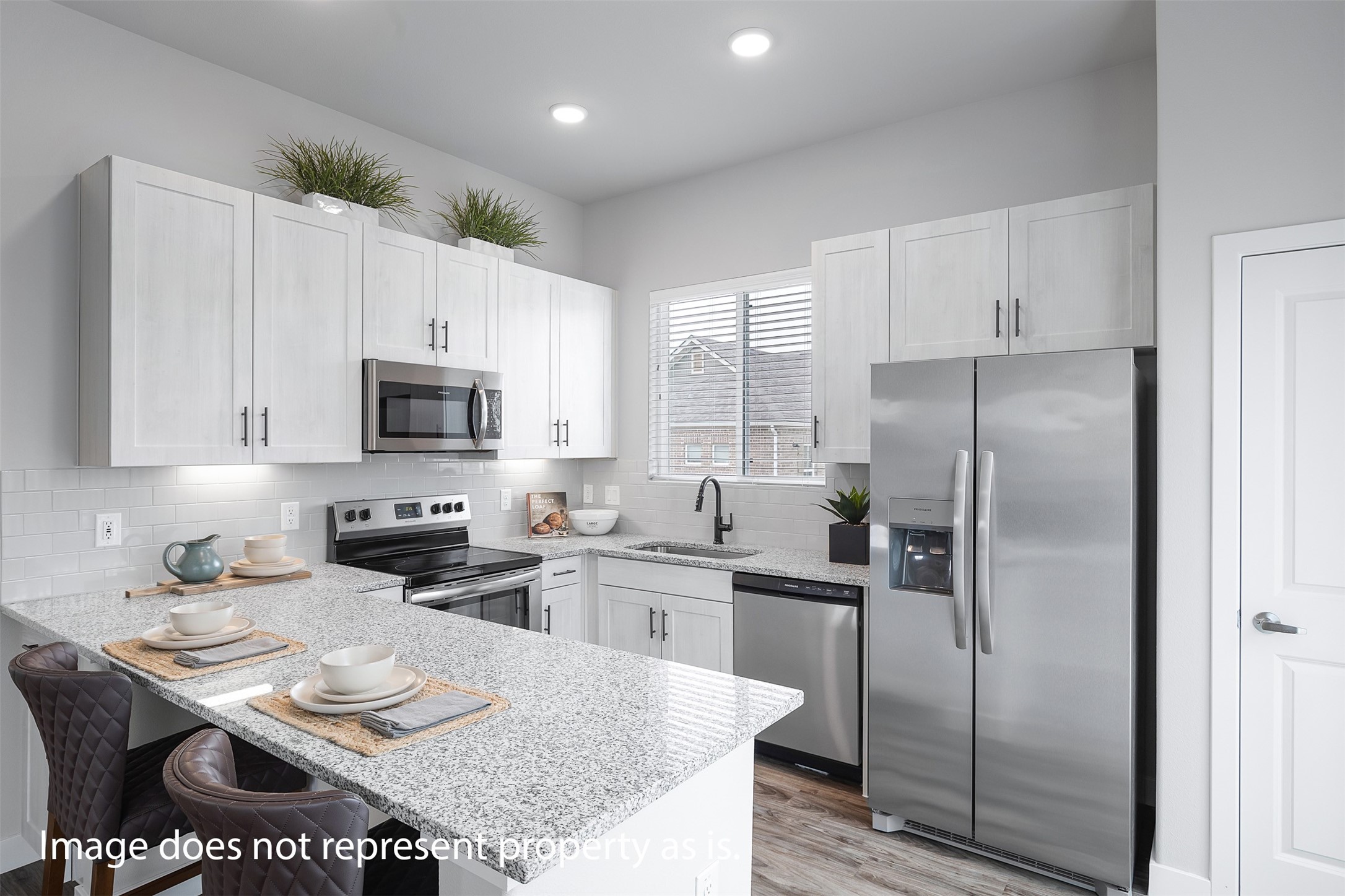 7201 Rustle Road Fort Worth, TX 76123 - Photo 8 of 29 a kitchen with stainless steel appliances granite countertop a refrigerator a stove a sink a dining table and chairs