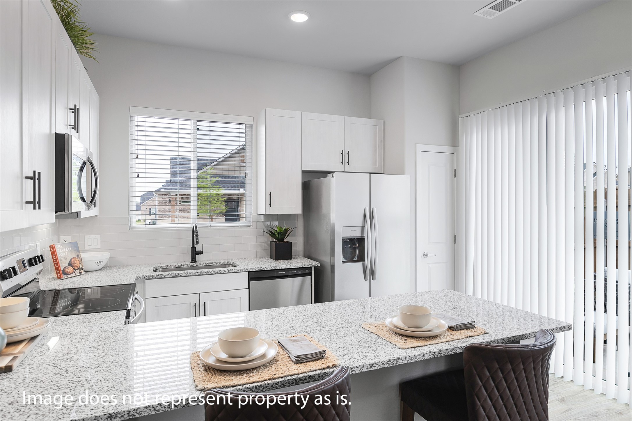 7201 Rustle Road Fort Worth, TX 76123 - Photo 9 of 29 a kitchen with stainless steel appliances granite countertop a sink a stove a refrigerator and cabinets
