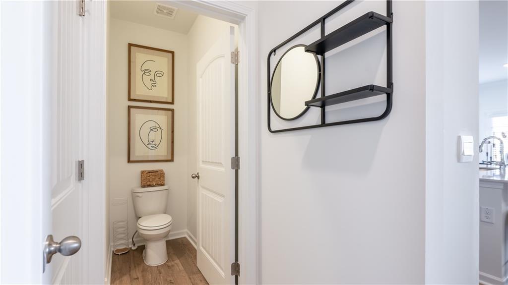 3572 Matthew Court Decatur, GA 30034 - Photo 14 of 33 a white toilet sitting next to a shower curtain