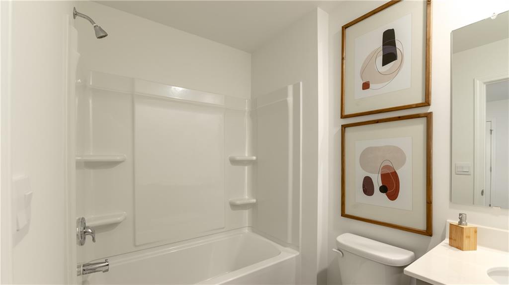 3572 Matthew Court Decatur, GA 30034 - Photo 18 of 33 a bathroom with a bathtub and a shower