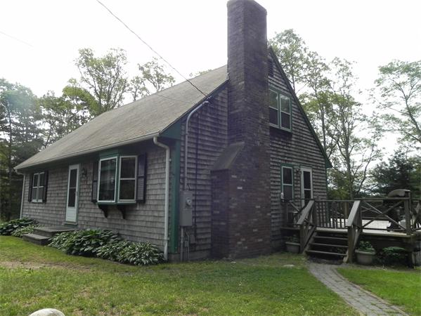 17 Spectacle Pond Road Wareham, MA 02538 - Photo 1 of 19 a front view of a house with a garden
