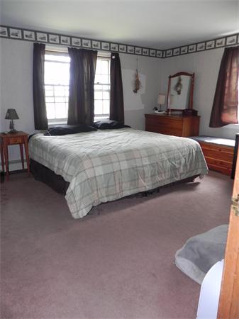 17 Spectacle Pond Road Wareham, MA 02538 - Photo 12 of 19 a bedroom with a bed and window
