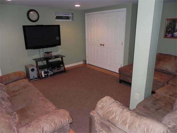 17 Spectacle Pond Road Wareham, MA 02538 - Photo 17 of 19 a living room with furniture and a flat screen tv