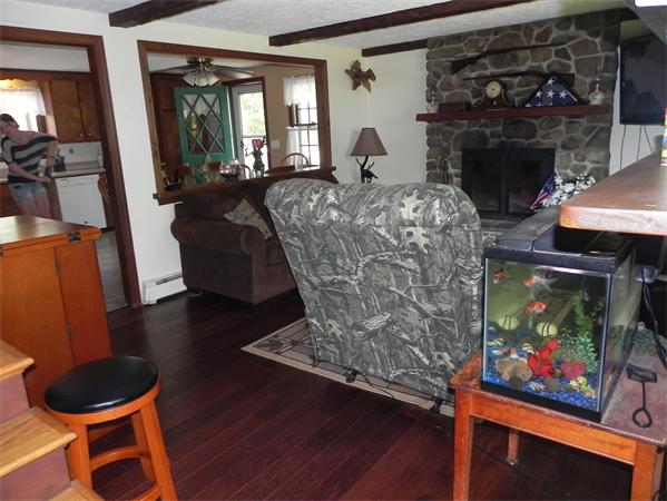 17 Spectacle Pond Road Wareham, MA 02538 - Photo 10 of 19 a living room with furniture and a fireplace