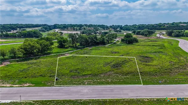 a view of a field with a big yard