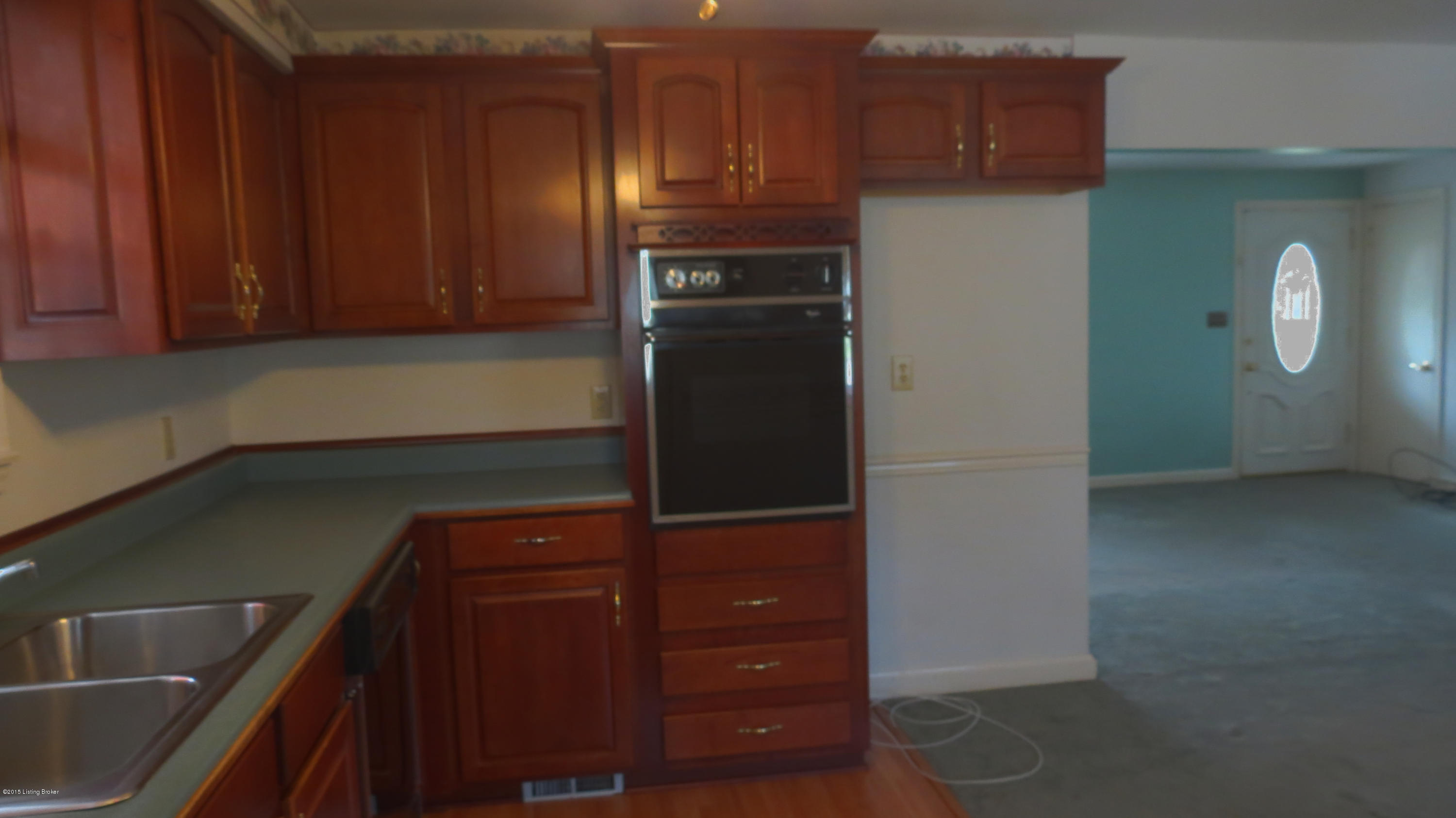 4615 Spen Lea Road Louisville, KY 40216 - Photo 3 of 34 Open Kitchen with custom cherry cabinets and wood floor.