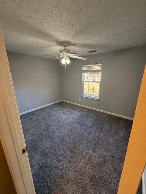 836 Freedom Walk Locust Grove, GA 30248 - Photo 16 of 21 an empty room with windows and fan