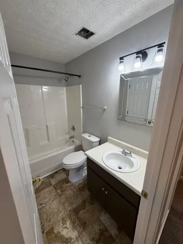 a view of outdoor space with playground and green space