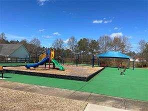836 Freedom Walk Locust Grove, GA 30248 - Photo 21 of 21 a view of outdoor space with playground and green space