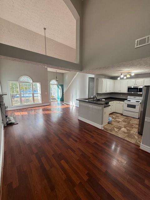 836 Freedom Walk Locust Grove, GA 30248 - Photo 5 of 21 a view of a kitchen with wooden floor and an empty room