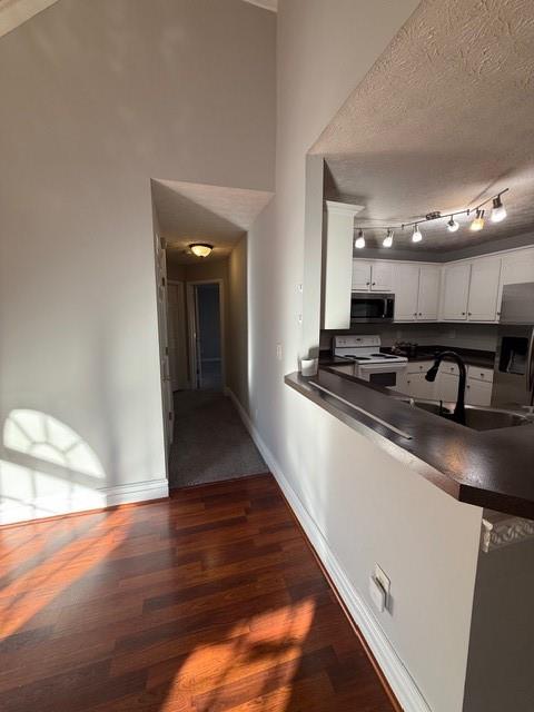 836 Freedom Walk Locust Grove, GA 30248 - Photo 6 of 21 a view of kitchen with stove and wooden floor