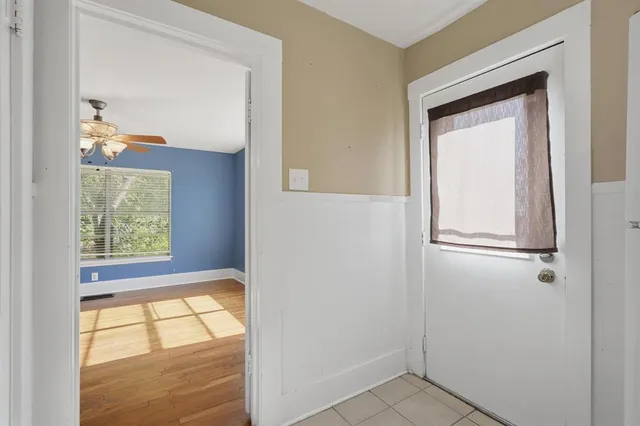 a view of an empty room with a window