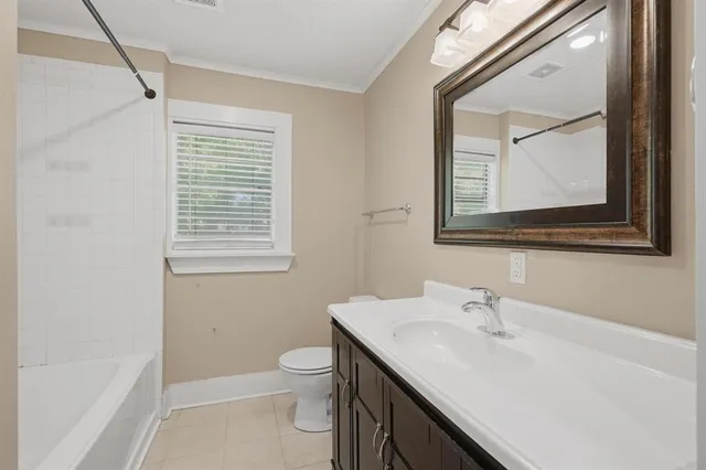 a bathroom with a sink a vanity and a toilet