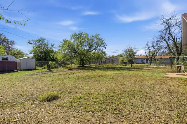 a backyard of a house with lots of green space