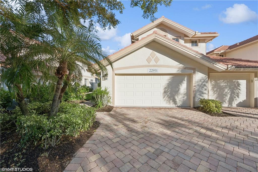 22931 Rosedale Drive, Unit 101 Estero, FL 34135 - Photo 1 of 35 a view of a house with a yard