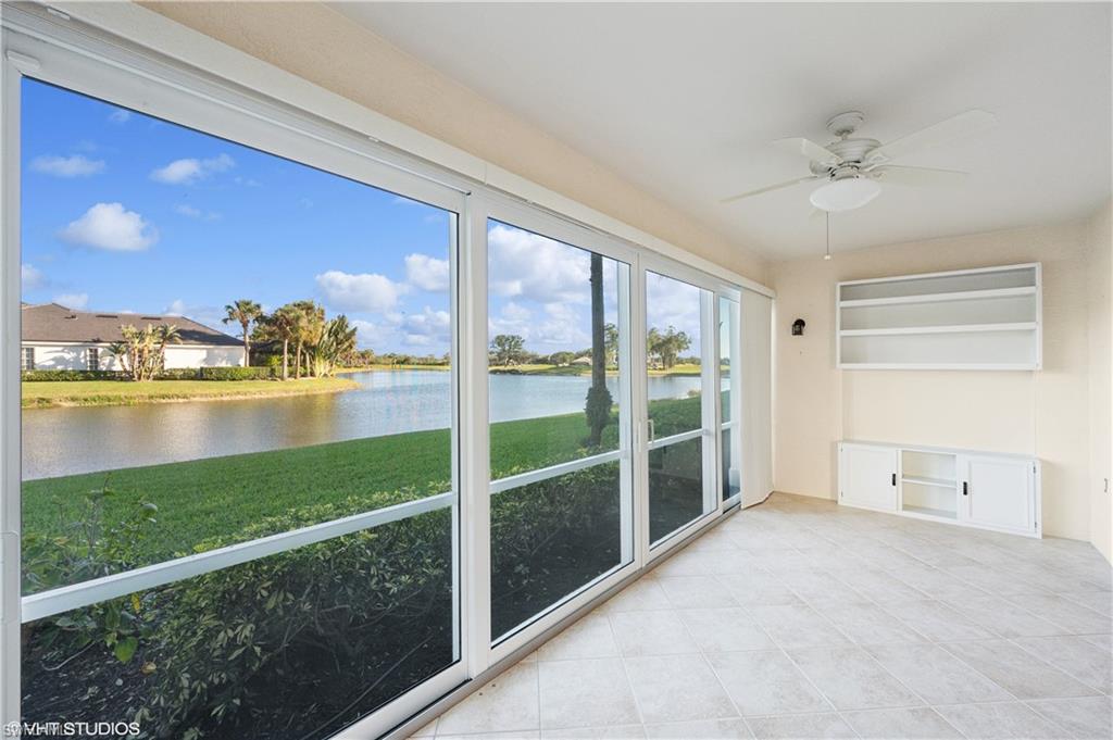 22931 Rosedale Drive, Unit 101 Estero, FL 34135 - Photo 11 of 35 a view of a living room and floor to ceiling window