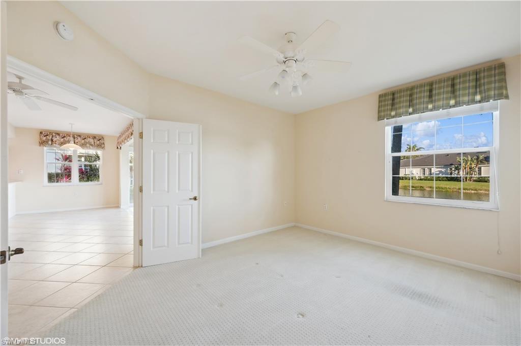 22931 Rosedale Drive, Unit 101 Estero, FL 34135 - Photo 16 of 35 a view of an empty room with a window