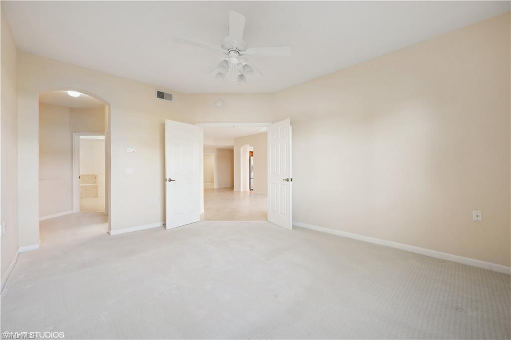 22931 Rosedale Drive, Unit 101 Estero, FL 34135 - Photo 18 of 35 a view of an empty room and a bathroom