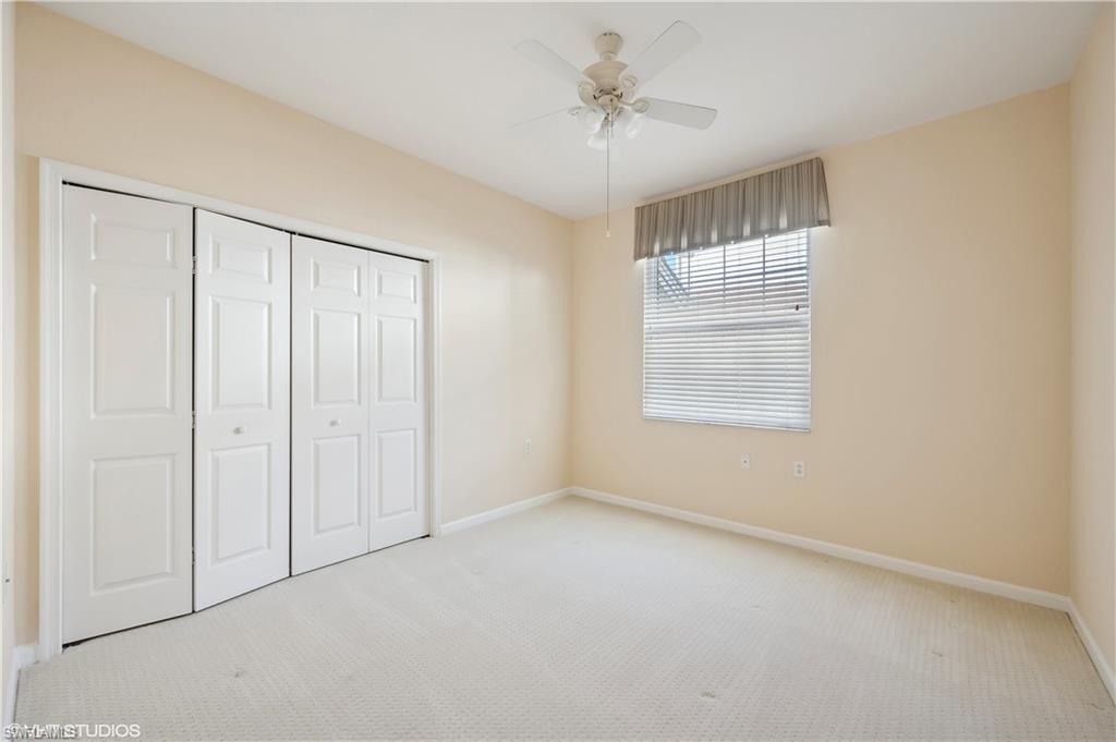 22931 Rosedale Drive, Unit 101 Estero, FL 34135 - Photo 20 of 35 a view of an empty room with a window