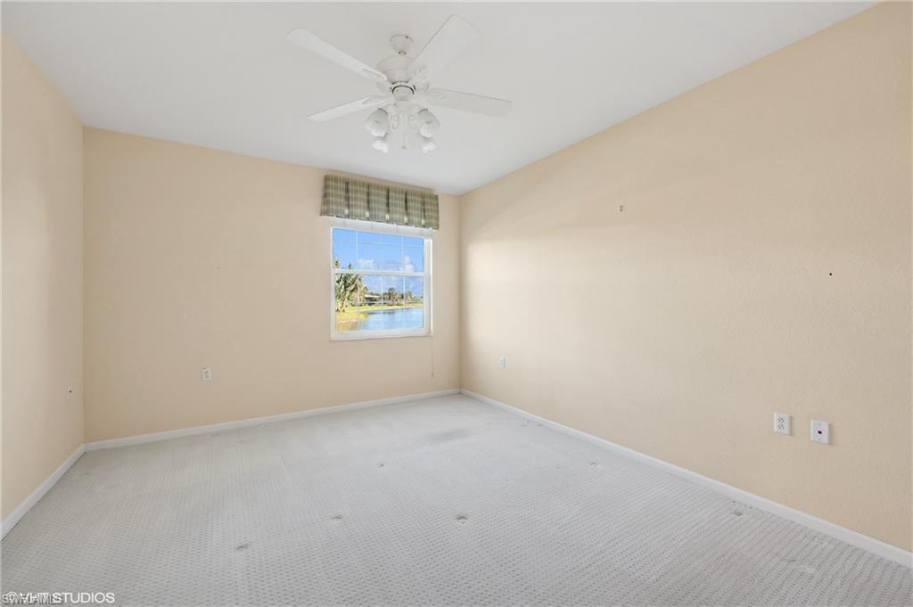 22931 Rosedale Drive, Unit 101 Estero, FL 34135 - Photo 21 of 35 an empty room with windows