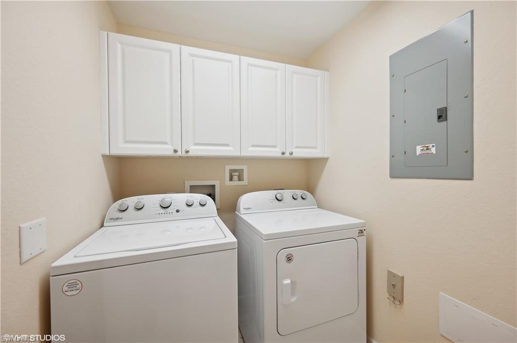 22931 Rosedale Drive, Unit 101 Estero, FL 34135 - Photo 23 of 35 a utility room with dryer and washer