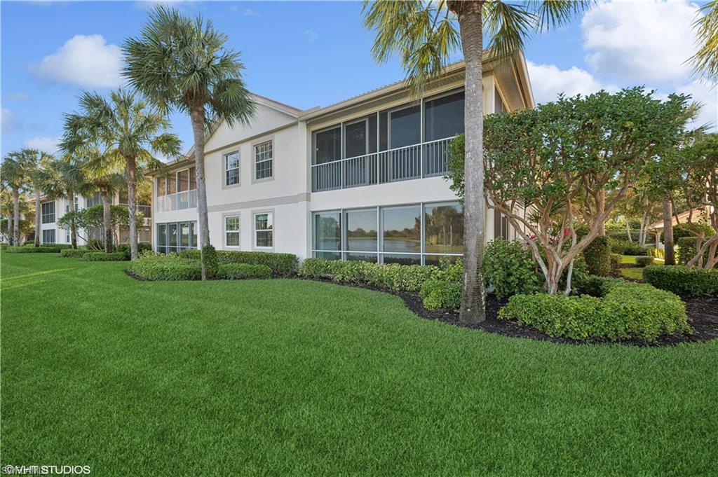 22931 Rosedale Drive, Unit 101 Estero, FL 34135 - Photo 25 of 35 a view of a house with a yard