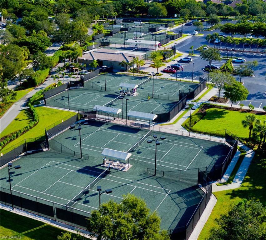 22931 Rosedale Drive, Unit 101 Estero, FL 34135 - Photo 28 of 35 an aerial view of a tennis ground and tennis court