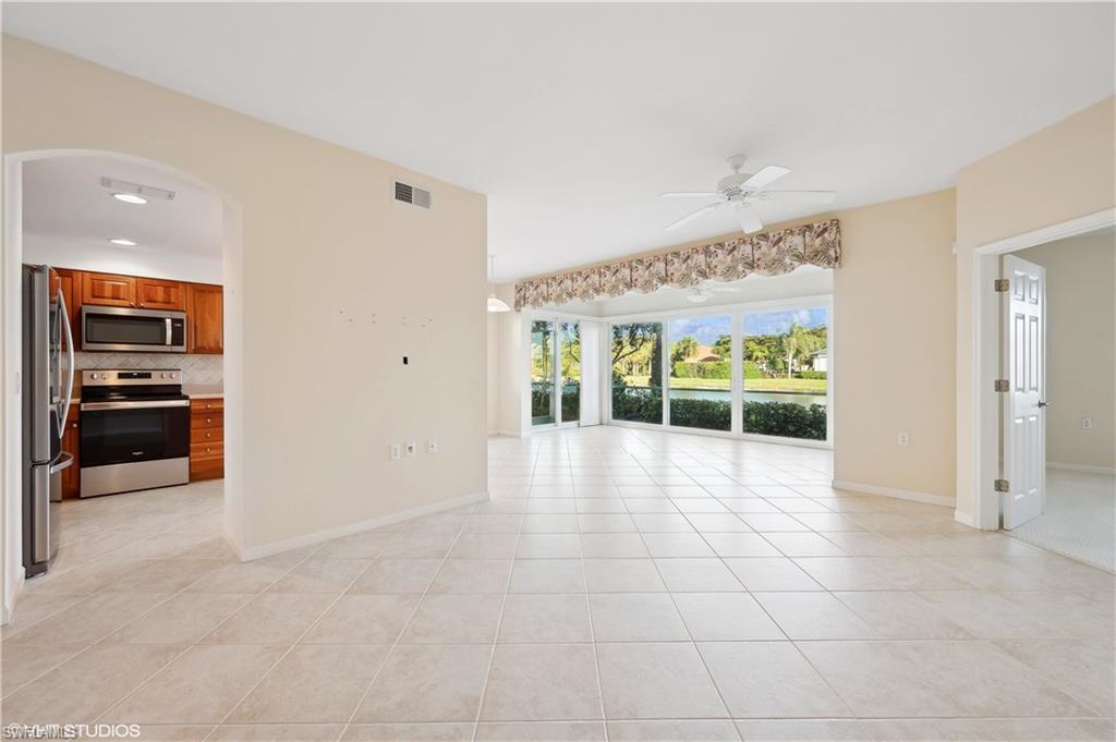 22931 Rosedale Drive, Unit 101 Estero, FL 34135 - Photo 5 of 35 a view of an empty room with a window